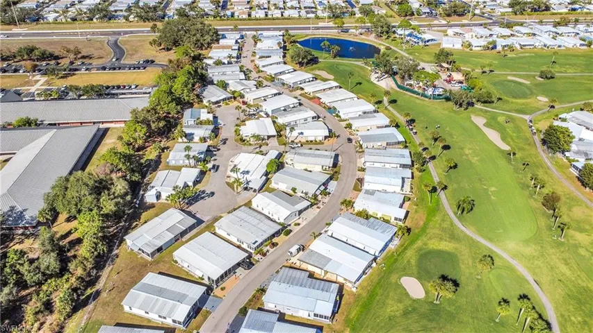 Aerial view of property's location with nearby suburban area and a nearby body of water