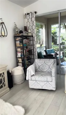Living area with light wood-type flooring