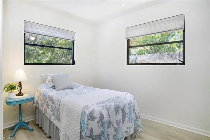Bedroom featuring light luxury vinyl wood-type flooring