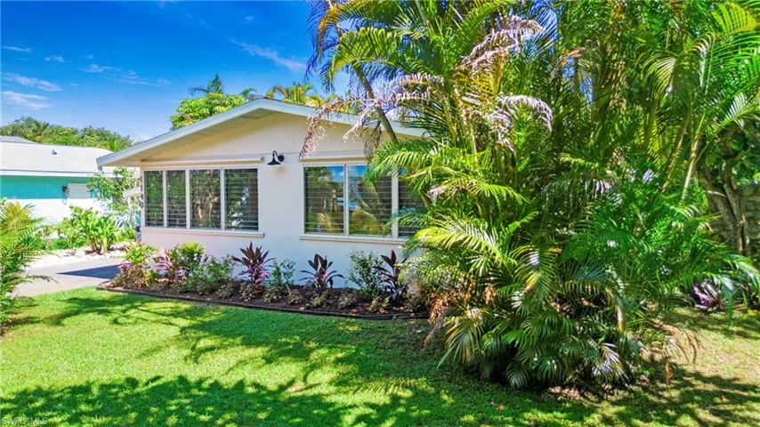Property exterior featuring front yard