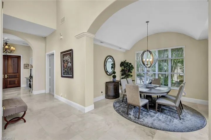 Dining room featuring vaulted ceiling