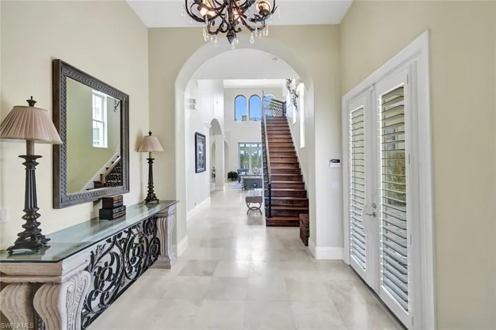 Bright entry hall with towering ceilings