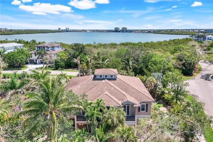 Aerial perspective of suburban area with a large body of water