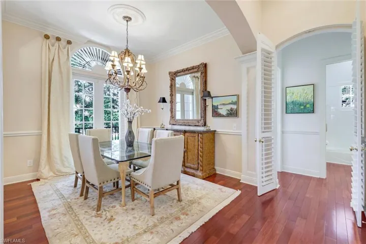 Bedroom with access to exterior, carpet floors, crown molding, and ceiling fan
