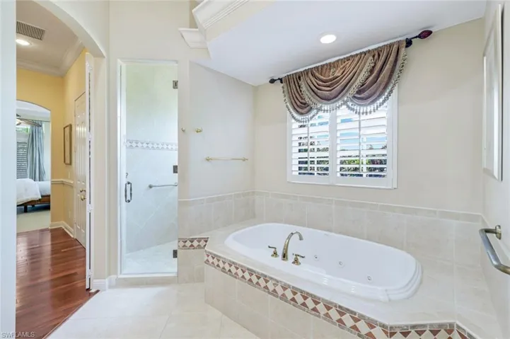 Carpeted bedroom with access to outside, baseboards, ornamental molding, and ceiling fan