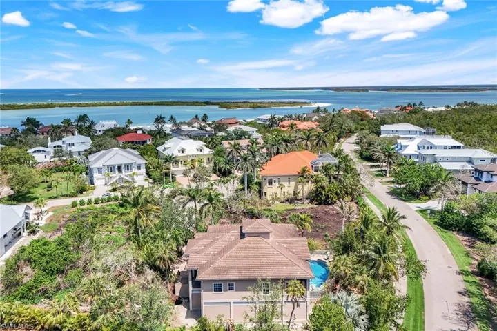 Aerial perspective of suburban area with a large body of water