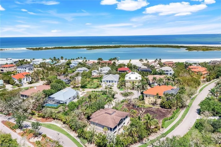 View of building exterior with uncovered parking