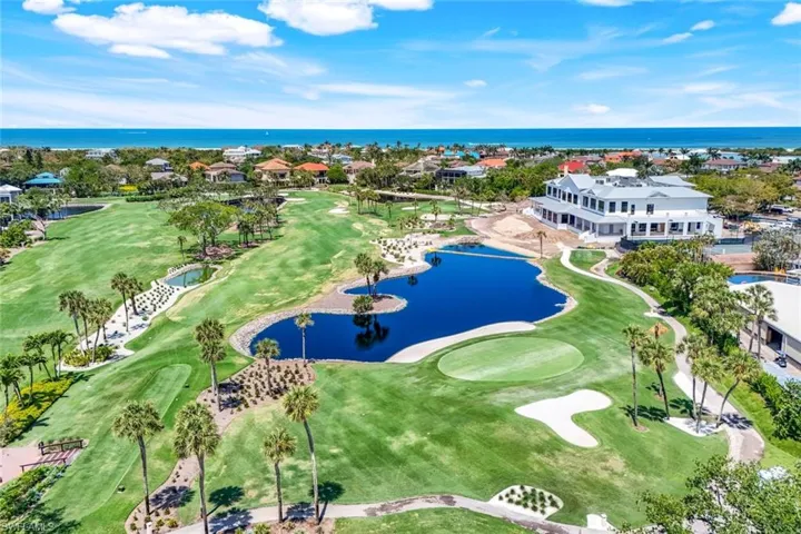 Bird's eye view of a nearby body of water and a golf club