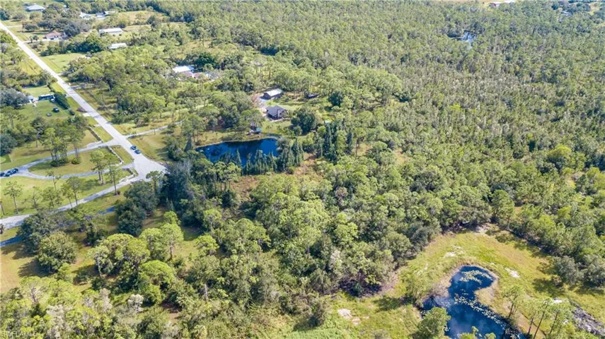 Aerial View Of 11540 Fox Hill Rd. The Adjacent 5 Acre Tract With Home And Outbuildings, Is Located In The Center Of The Adjacent 5 Acre Parcel Is Also AVAILABLE FOR SALE. These 2 Lovely Properties Meet In The Middle With A .75/Acre Private Lake.