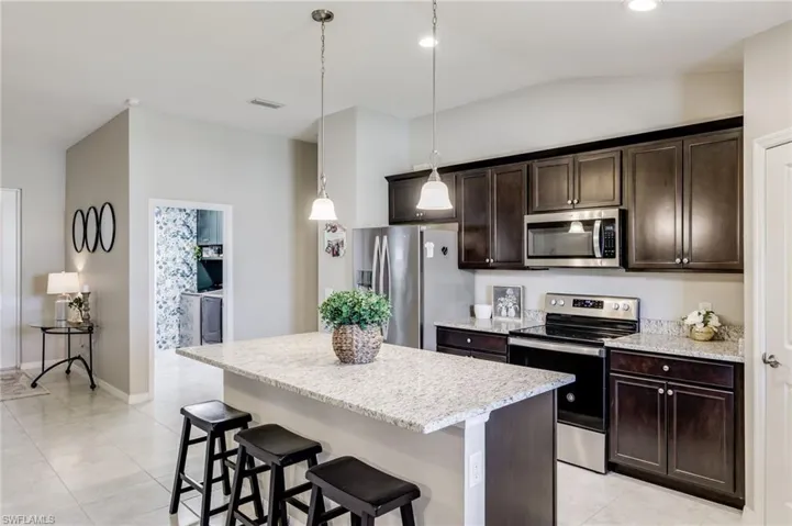 Kitchen with island bar seating