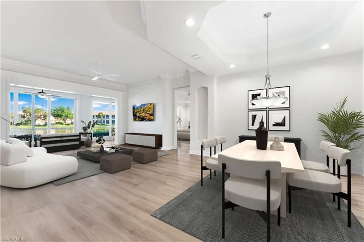 The living room and dining room here have been digitally staged. The ship lap wall is perect focal point in your living area.Tray ceilings, crown molding, luxury vinyl flooring throughout! There are upgrades throughout!