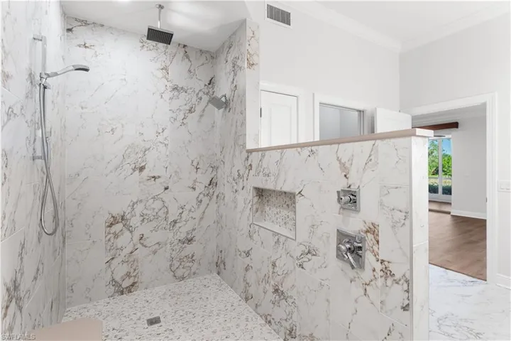 3 shower heads and a small niche for your toiletries.