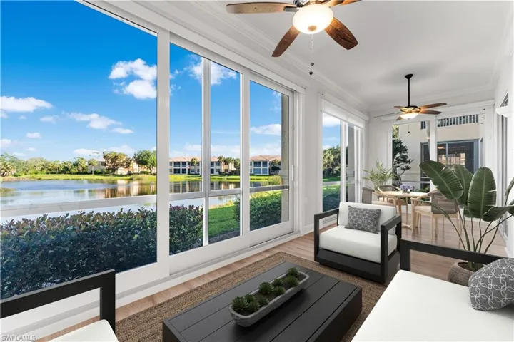 This room has been digitally staged. Hurricane Impact sliders offer peace of mind and spectacular views of the lake and beyond!
