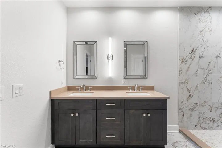 Your master bath offers dual comfort height vanities boasting quartz countertops.