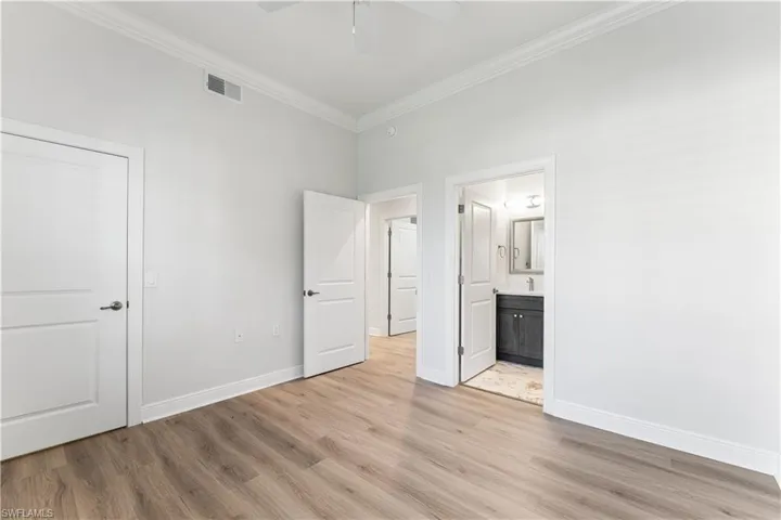 3rd bedroom has an ensuite bath with a walk in shower, floor to ceiling tile, single vanity. Walk in closet.