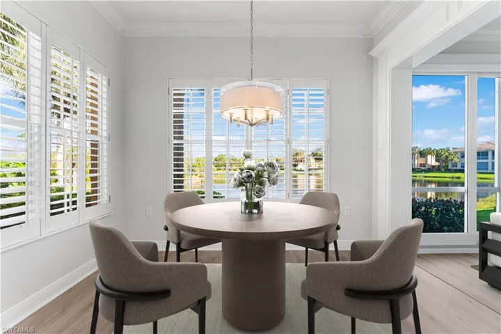 Breakfast nook has been digitally staged. Awe-inspring views of the lake from most every room in this condo! Crown molding, plantation shutters.So much natural light spills into this condo!