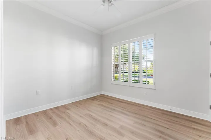 3rd bedroom has crown molding, plantation shutters.