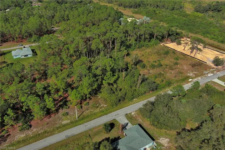 View of property location with a forest
