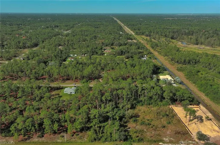 Aerial overview of property's location with a forest