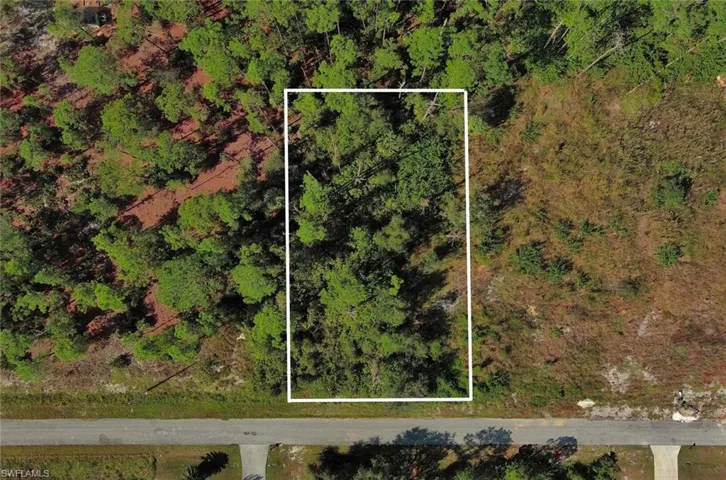 Aerial view of property's location featuring property parcel outlined