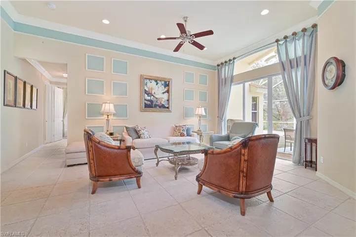Living area with ceiling fan, ornamental molding, and recessed lighting