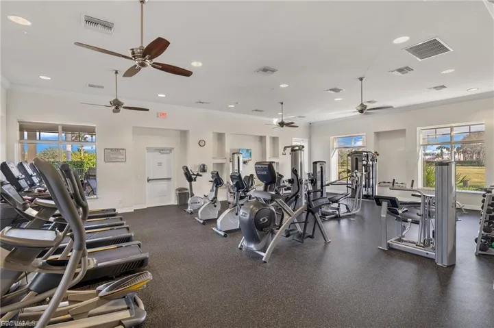 Workout area with recessed lighting, crown molding, and a ceiling fan