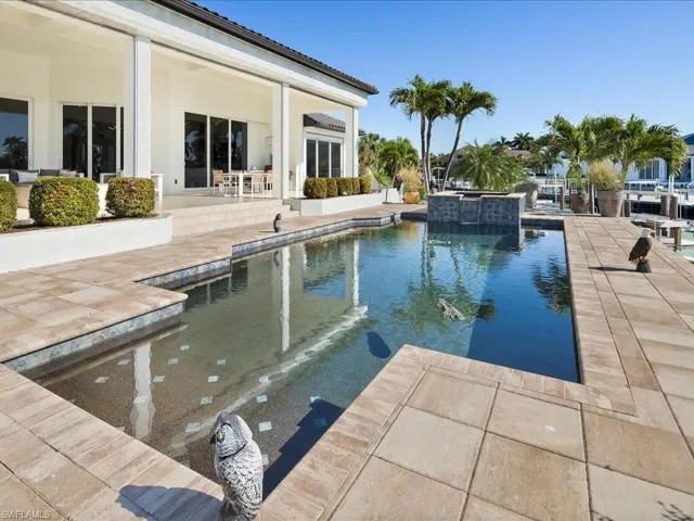 Relaxing pool / spa featuring a patio area