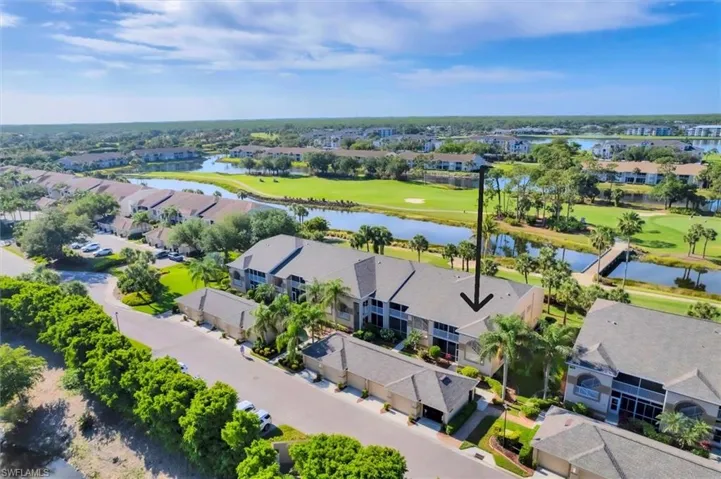 Birds eye view of property with a water view, view of golf course, and a residential view