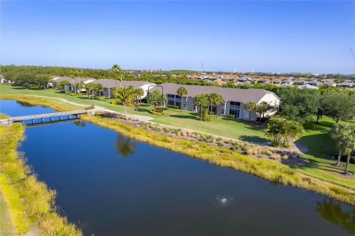 Drone / aerial view featuring a water view and a residential view