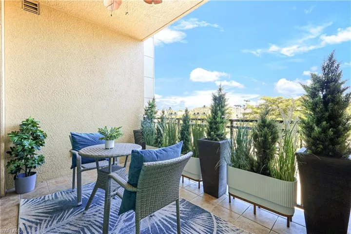 Balcony featuring a ceiling fan