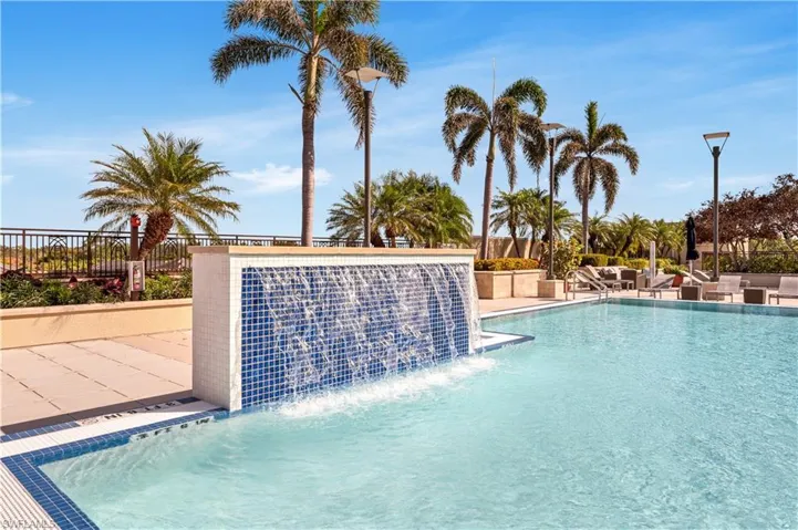 Community pool featuring a patio