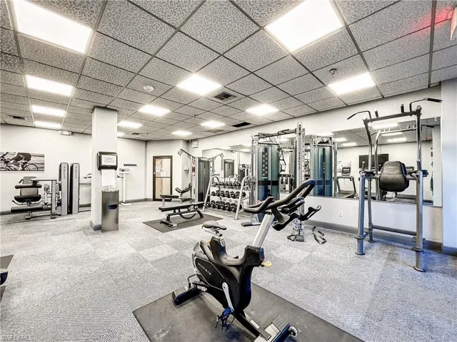 Exercise room featuring a drop ceiling