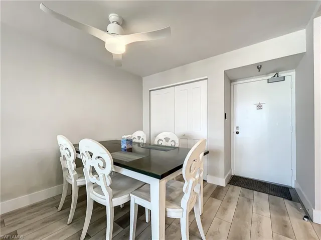 Dining room featuring light wood-style flooring and a ceiling fan