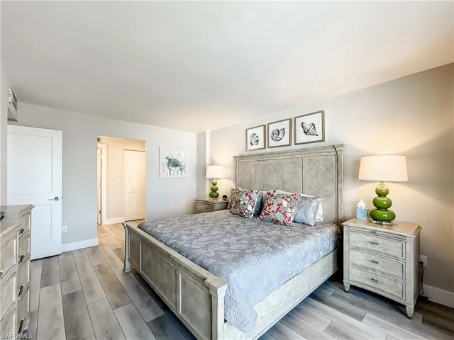 Bedroom with light wood-style floors and baseboards