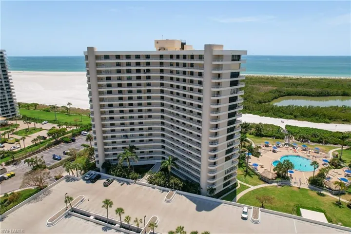View of apartment building / complex featuring a water view