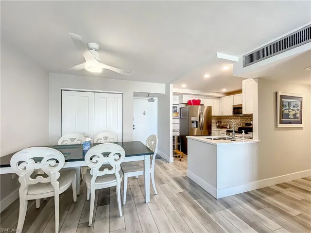 Dining area with ceiling fan, wood finish floors, and recessed lighting