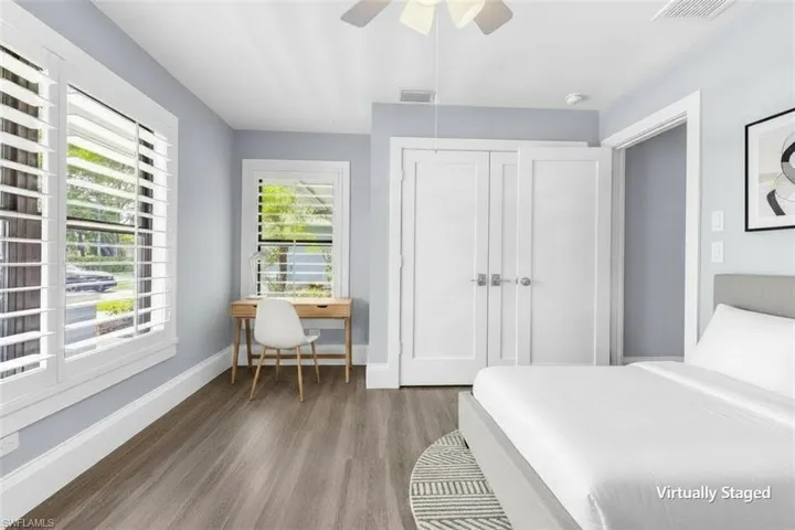 Light gray walls complemented by wood-finish flooring