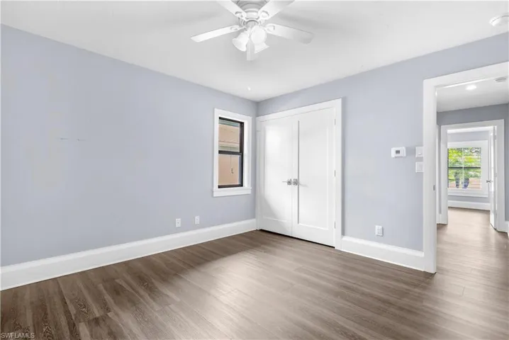 Light blue wall color complemented by wood-finish flooring