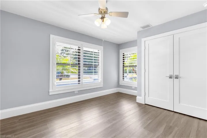Interior space featuring wood-finish flooring and light gray walls