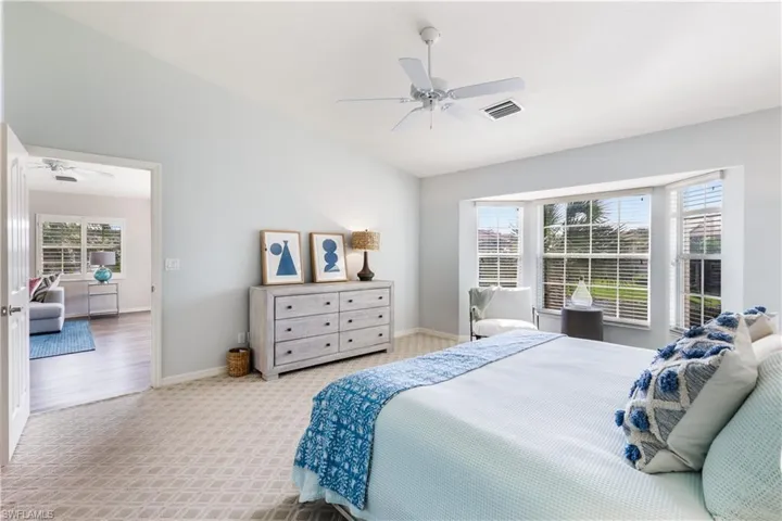 Bedroom featuring hardwood / wood-style floors and ceiling fan