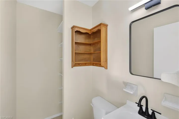 Bathroom featuring toilet and a sink