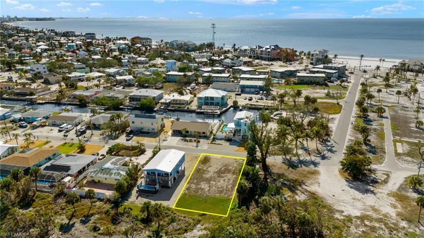 Birds eye view of property with a water view VIRTUALLY EDITED