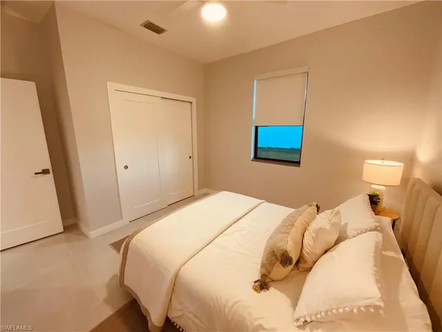 Bedroom with a closet and ceiling fan