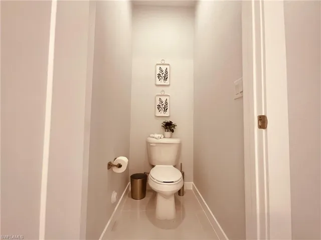 Bathroom featuring tile patterned flooring and toilet