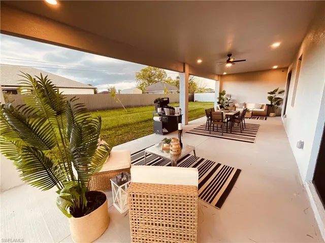 View of patio featuring outdoor lounge area and ceiling fan