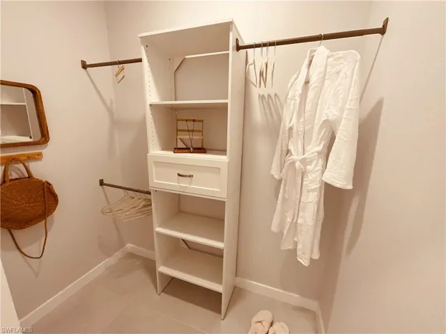 Walk in closet featuring tile patterned floors