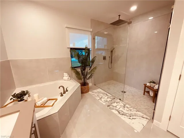 Bathroom with independent shower and bath and vanity