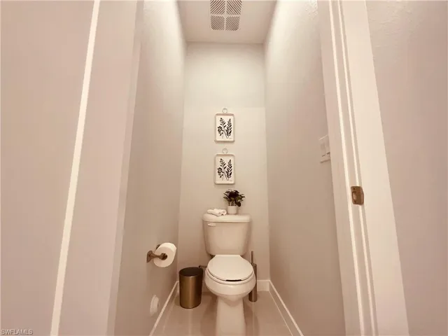 Bathroom featuring tile patterned floors and toilet