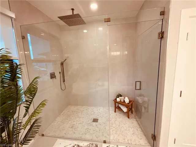 Bathroom with a shower with door