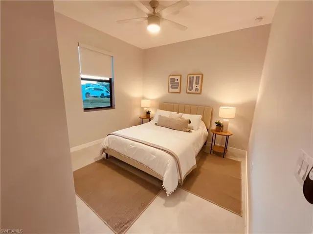 Bedroom featuring ceiling fan and light colored carpet